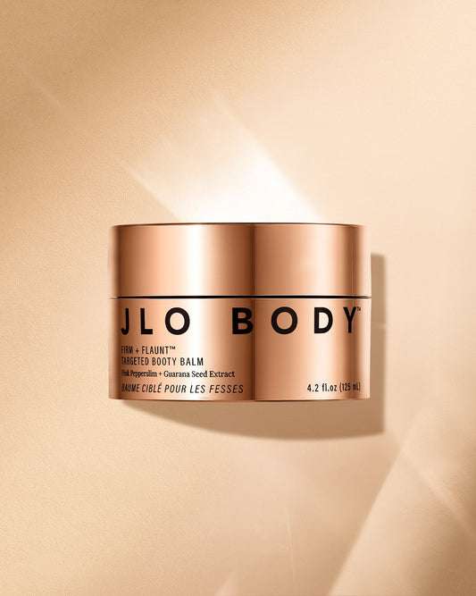 JLO Beauty Firm +Flaunt Booty Balm gold jar image on a gold background